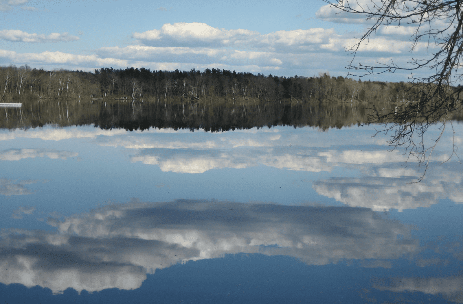 Big Chetac Lake with sky reflection.